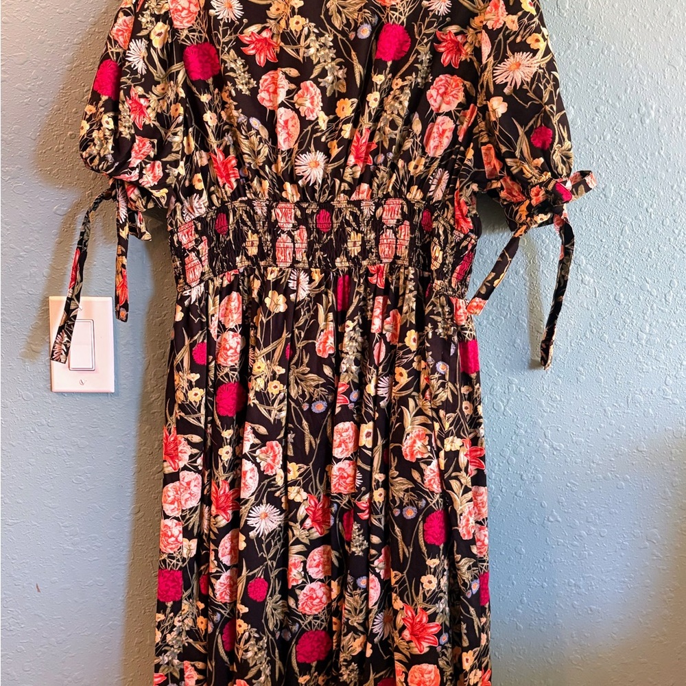 Terra& Sky floral dress black background and multicolored flowers.